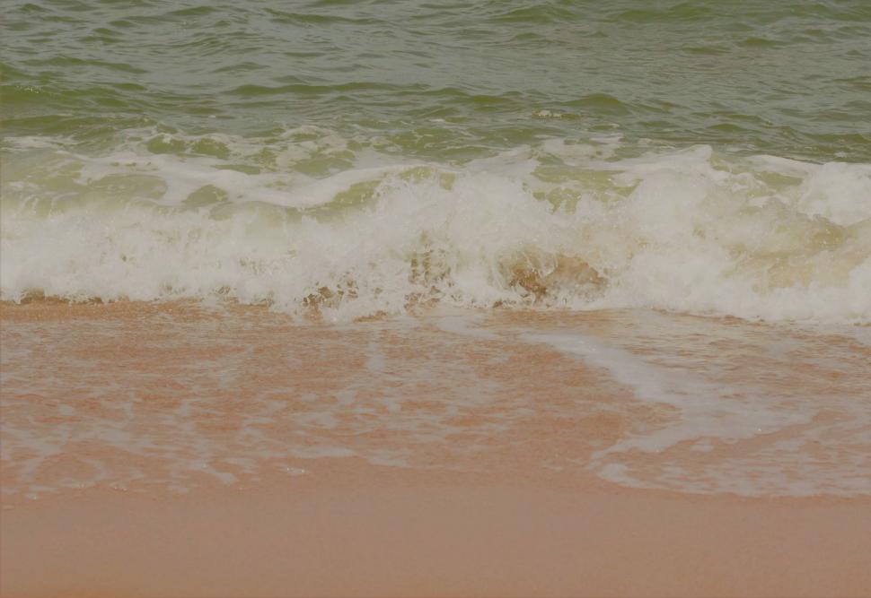 Free Image of Ocean wave breaking up on a beach  