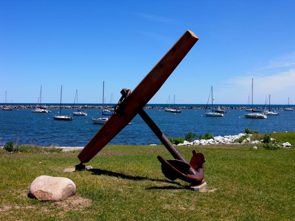 Free Image of Sculpture in Grass by Water 