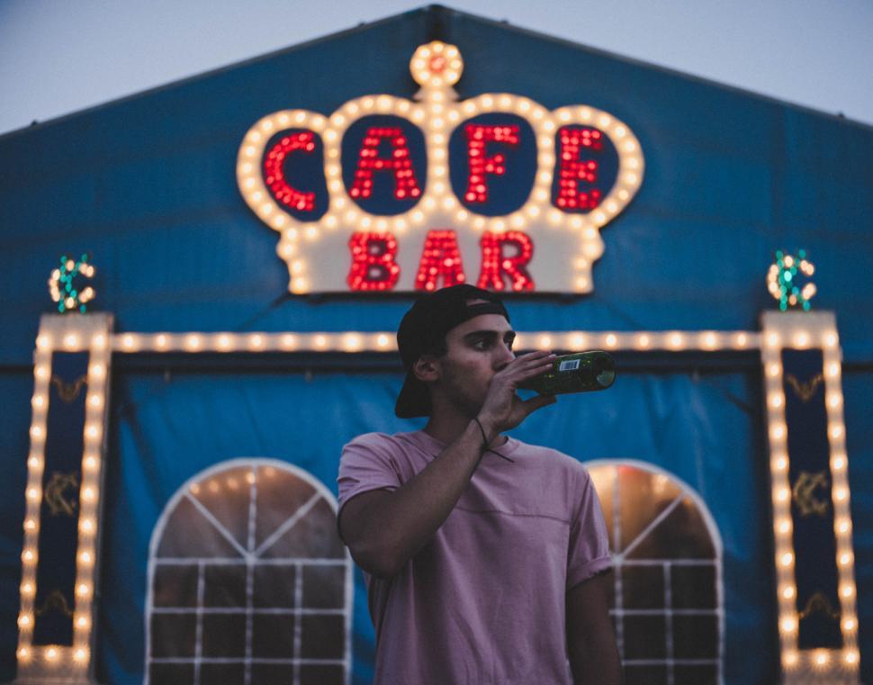 Free Image of Young man with bottle of beer 