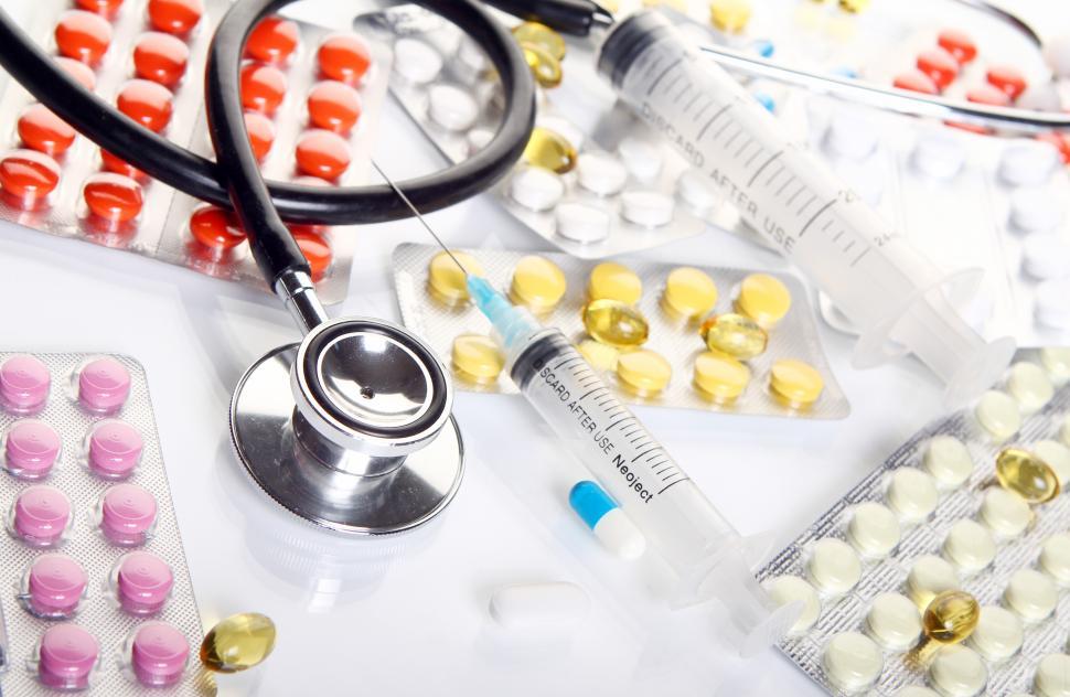 Free Image of Stethoscope with different pharmaceutical stuff 