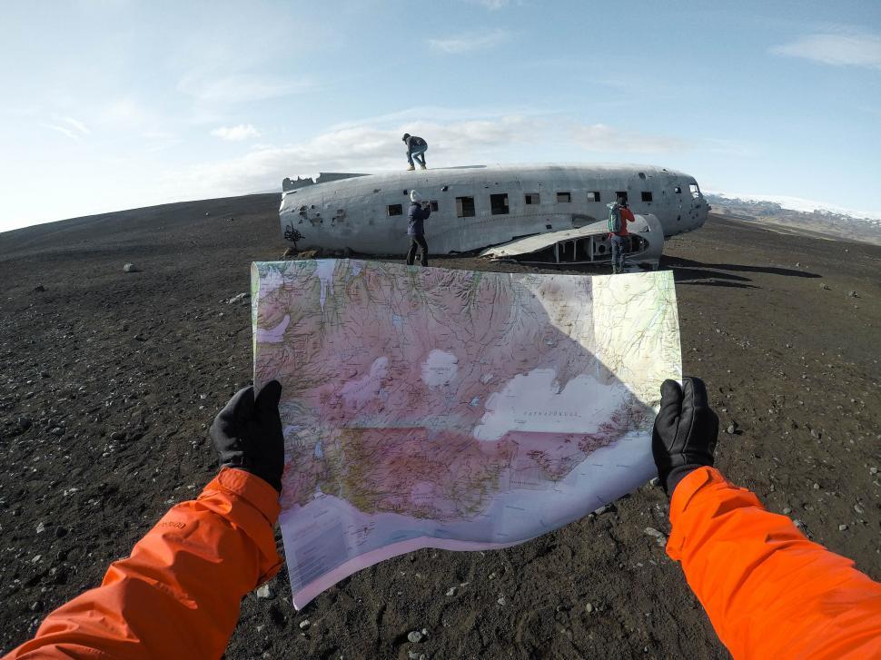 Free Image of Old plane wreck on black sand 