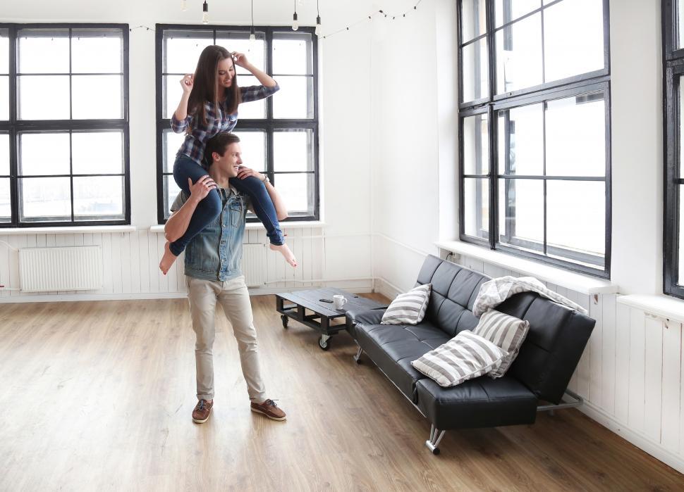 Free Image of Woman sitting on a mans shoulders 