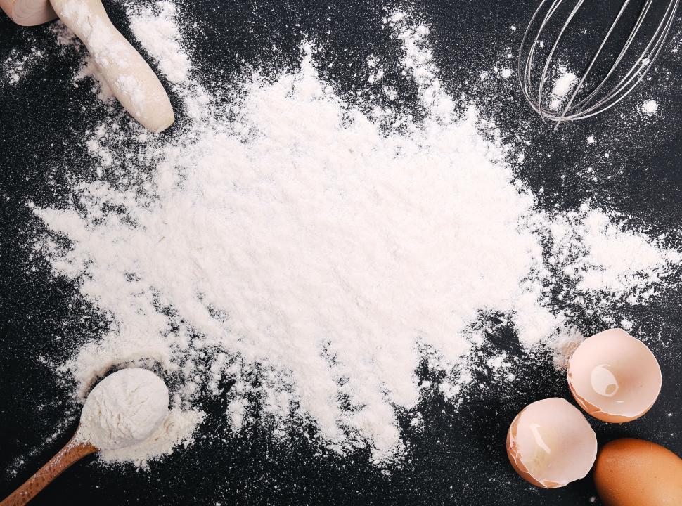 Free Image of Flour on the workbench with cooking elements 