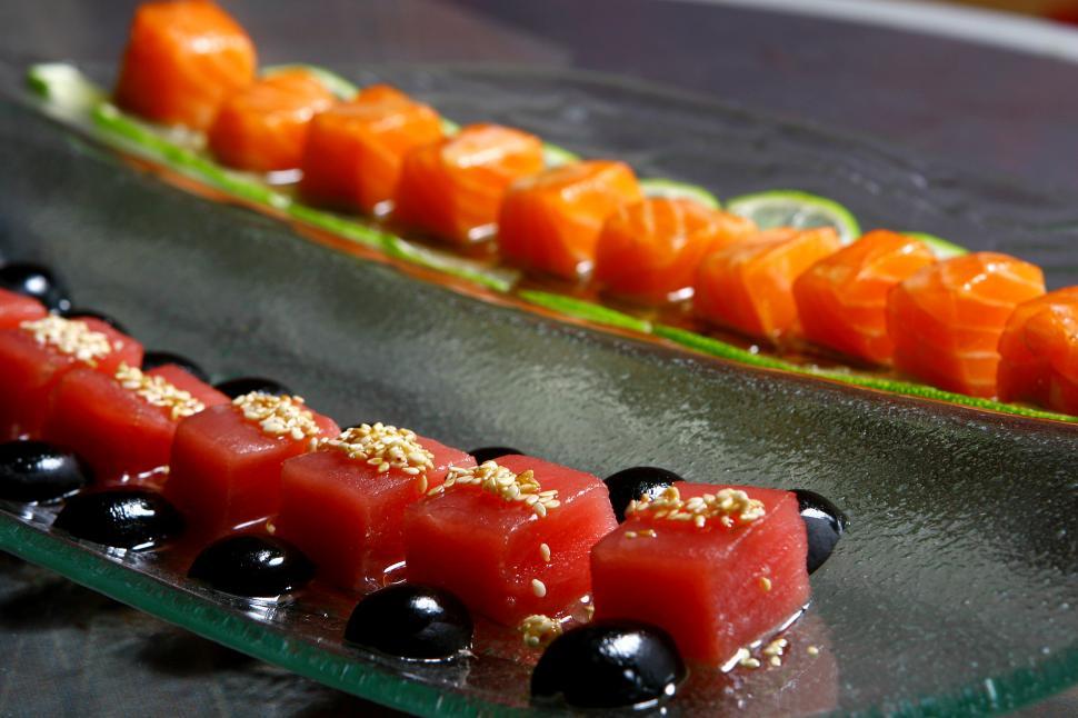 Free Image of Fresh salmon and a tuna sushi with sauces 