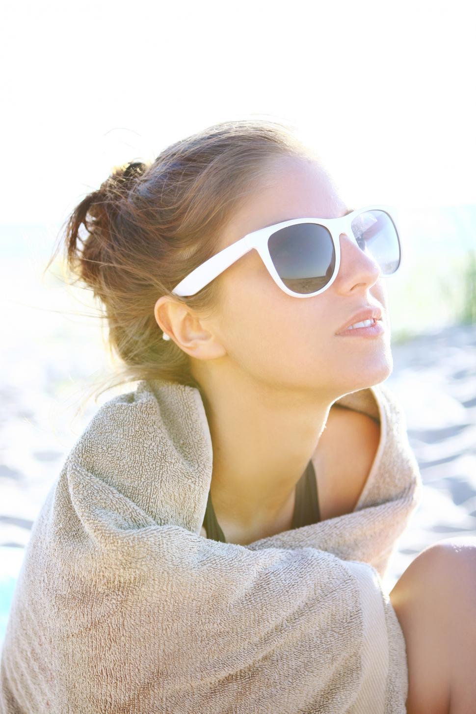 Free Image of Woman in the sun on the beach 