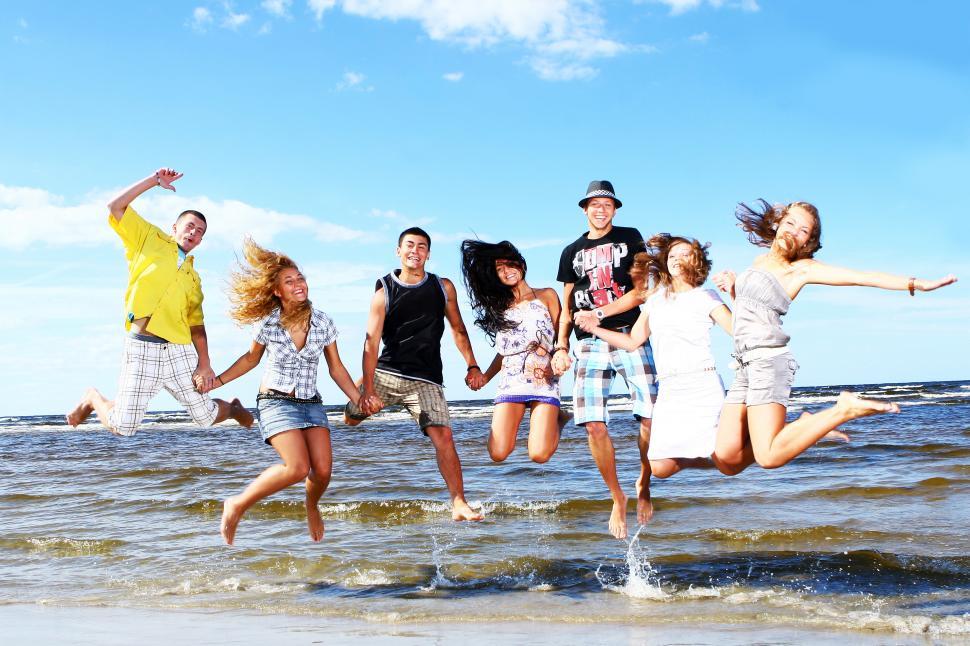 Free Image of Group of friends jumping in the air 