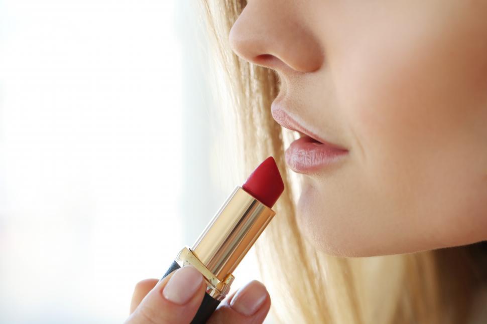 Free Image of Putting on lipstick 