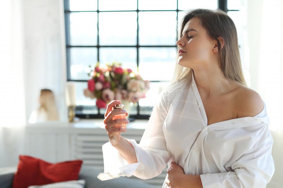 Free Image of Spraying perfume 