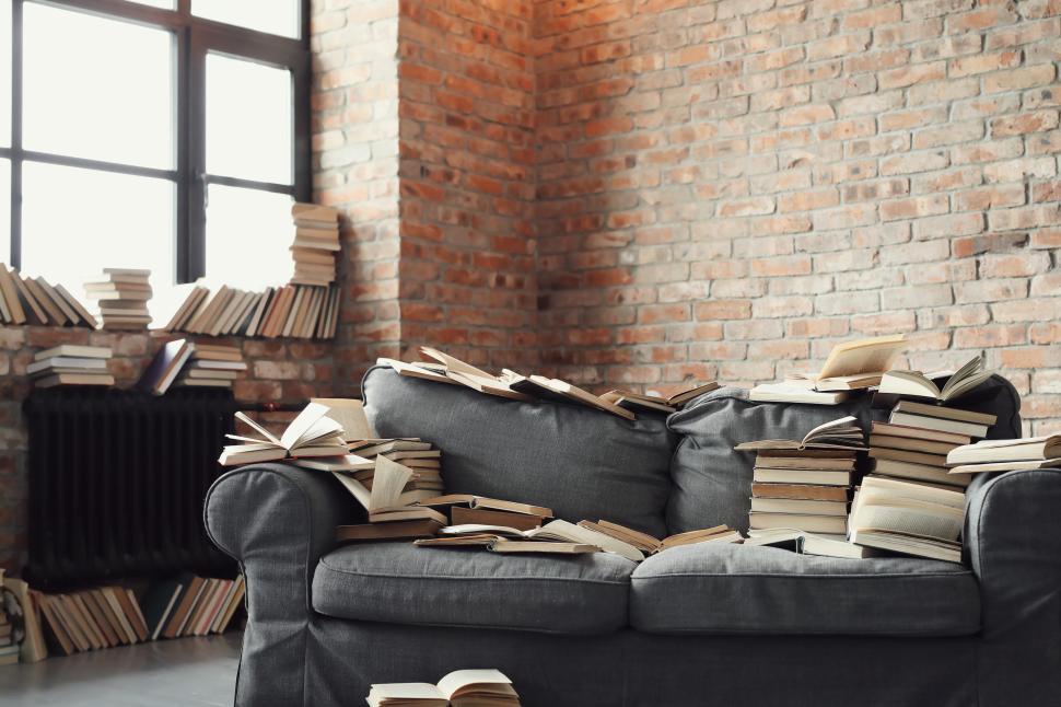 Free Image of Reading materials cover the room 