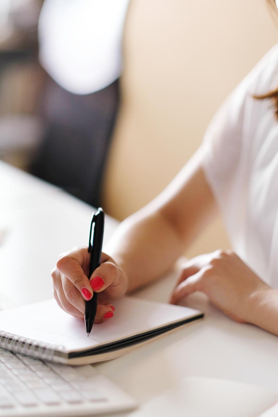 Free Image of People at work - taking notes or writing 