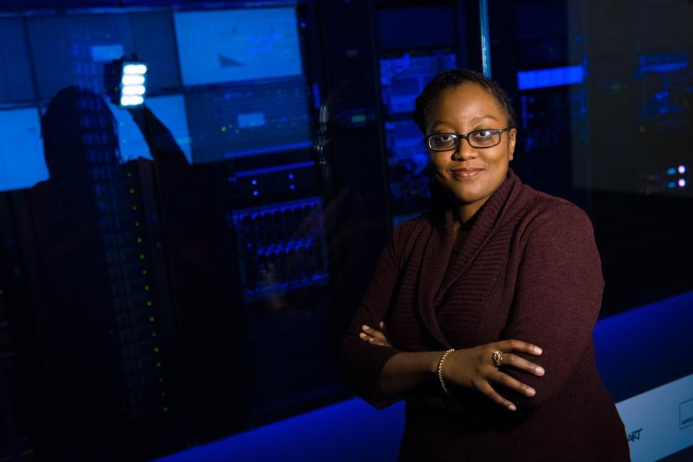 Free Image of Happy woman engineer in network server room 