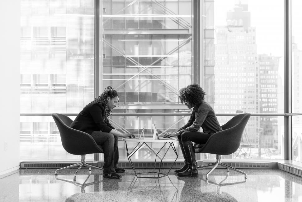 Free Image of Female co-workers using tablet device - b&w 