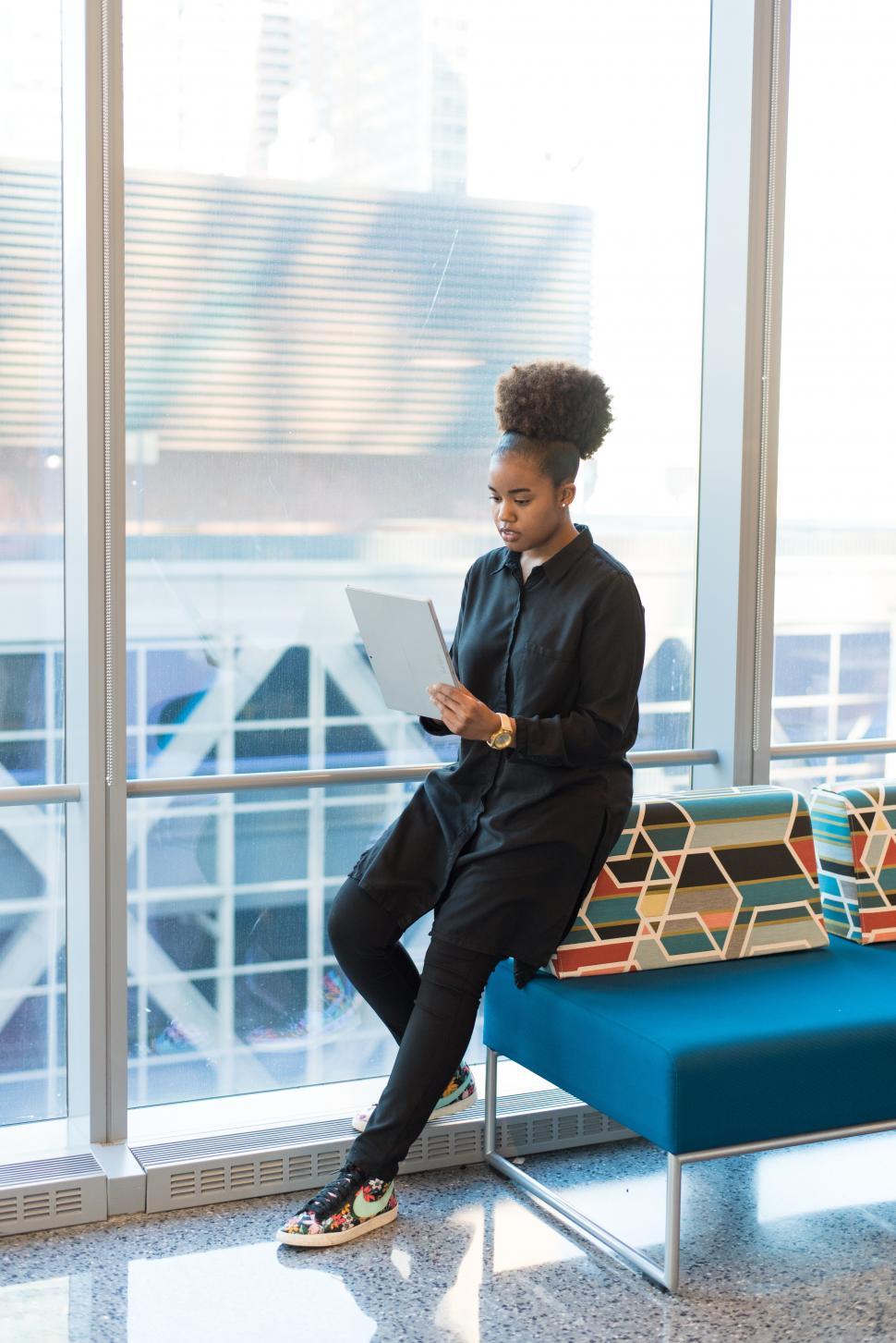 Free Image of Woman holding tablet computer in office 
