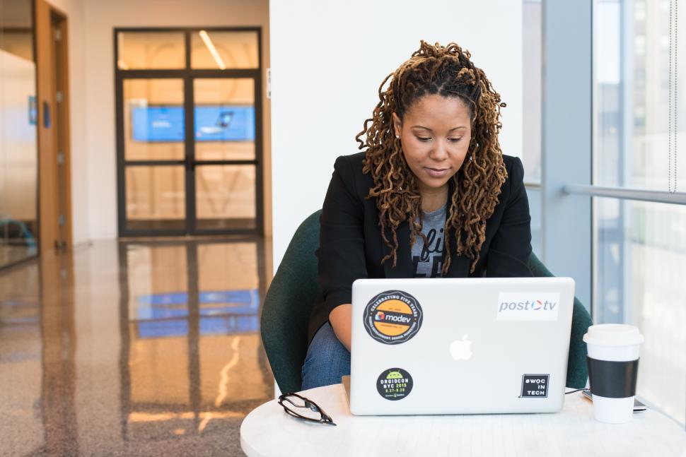 Free Image of Female programmer with laptop - looking at screen 