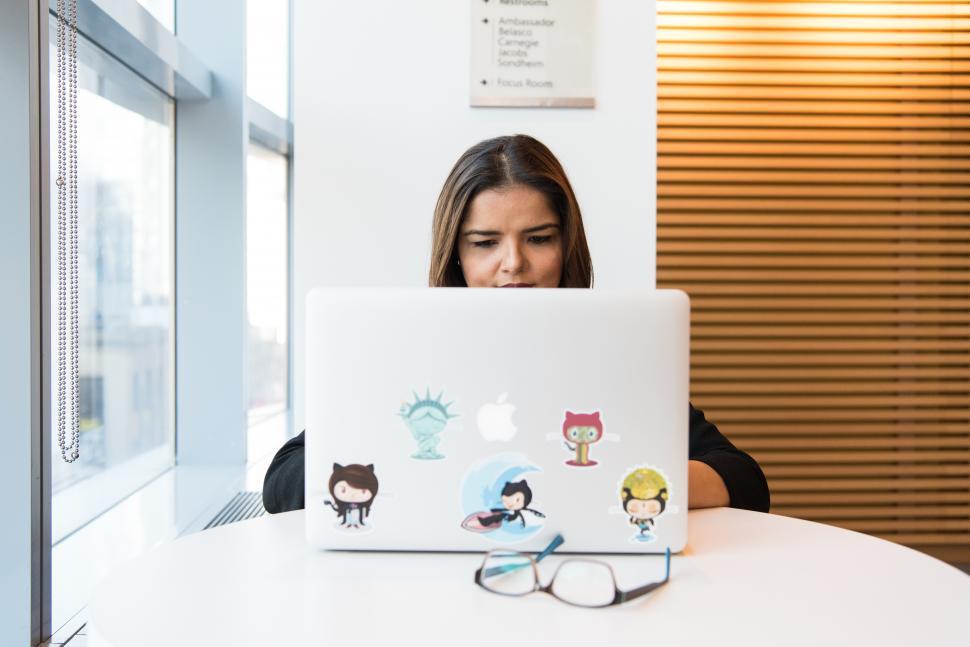 Free Image of Businesswoman working on laptop in office 