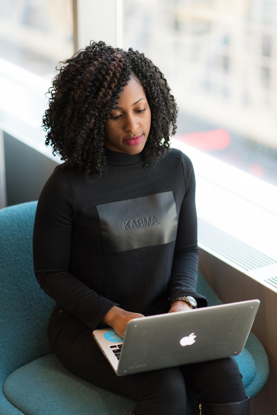 Free Image of Businesswoman in casual clothing working on laptop 
