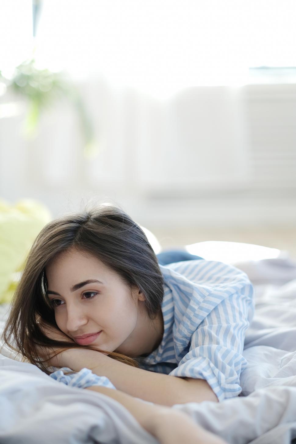 Free Image of Lounging thoughtfully in bed 