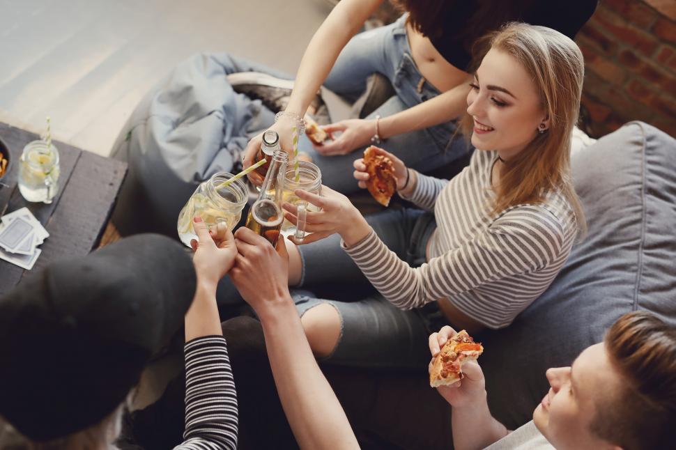 Free Image of People toast with drinks at a party 