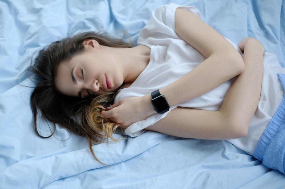 Free Image of Woman sleeping, with smartwatch 