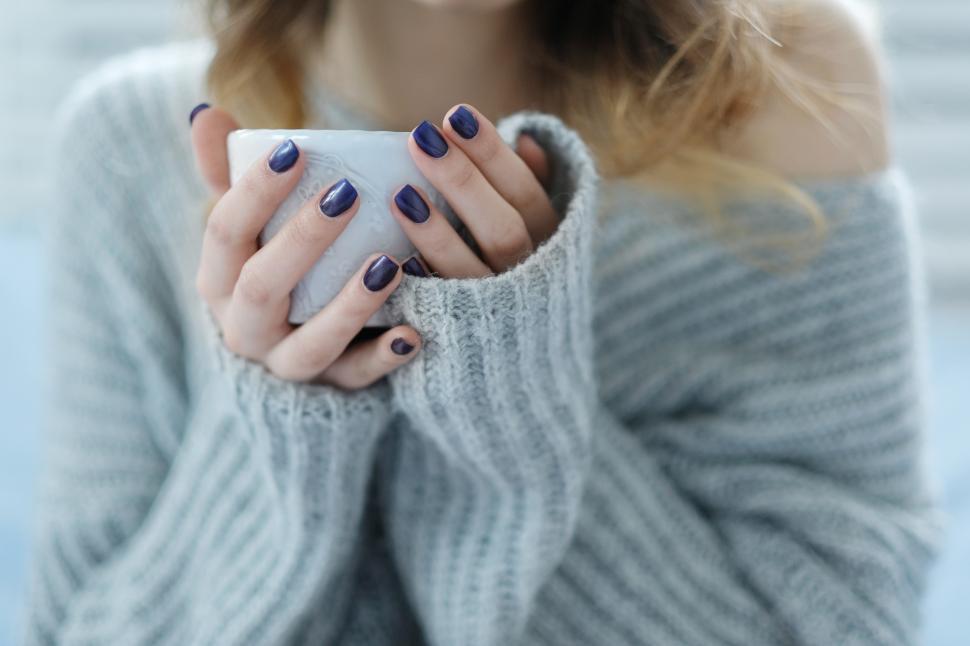 Free Image of Hands hold a cup of coffee 