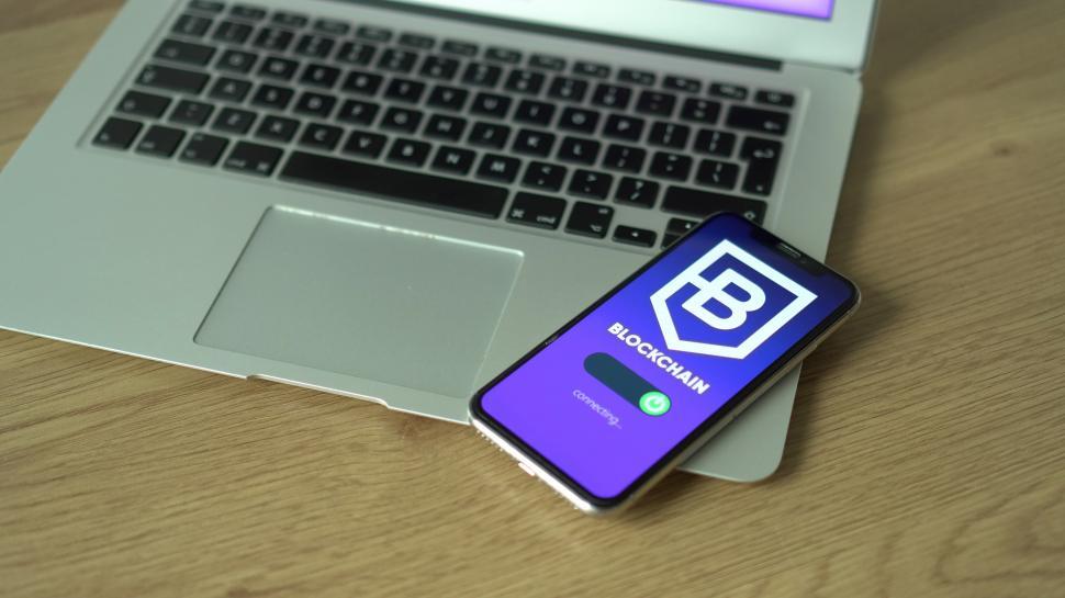 Free Image of Cell Phone on Top of Laptop Computer 