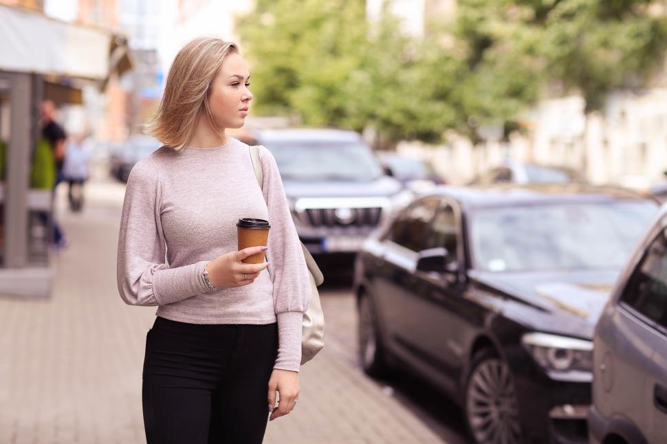 Free Image of Woman walking in a city 