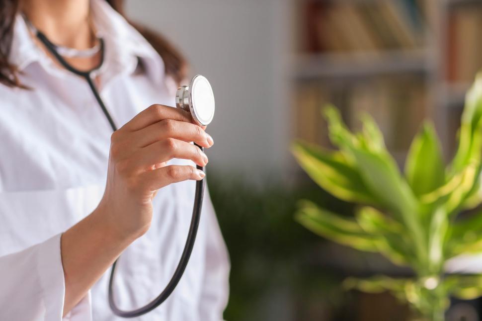 Free Image of Doctor holding up stethoscope 