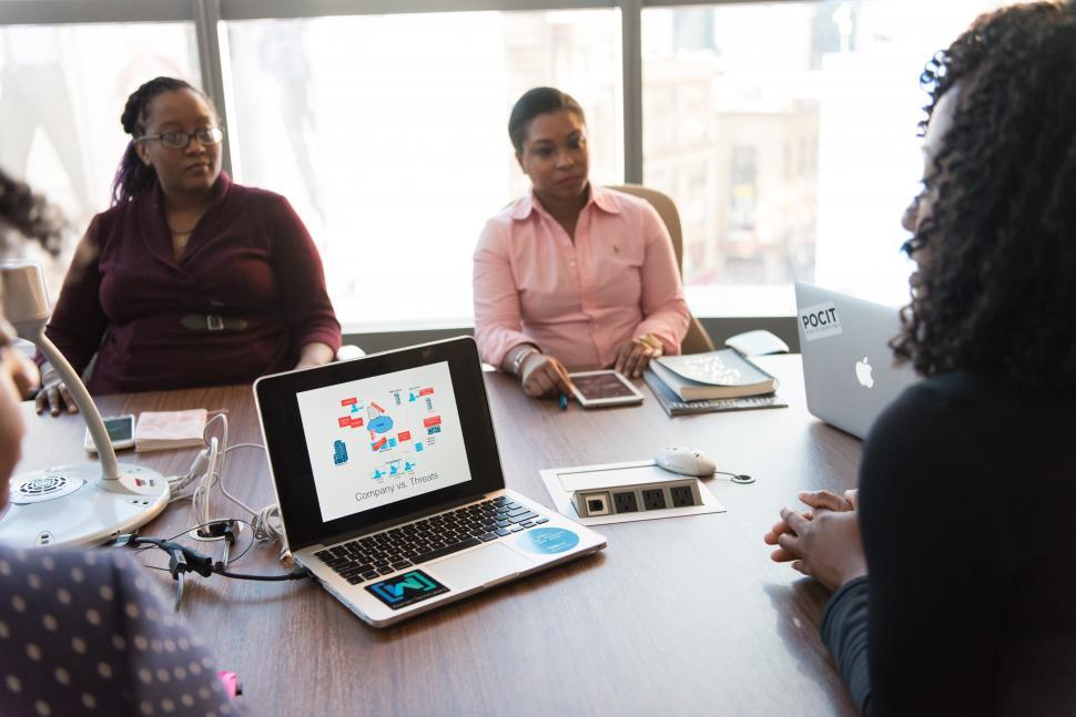 Free Image of Businesswomen discussing with laptop in meeting room 