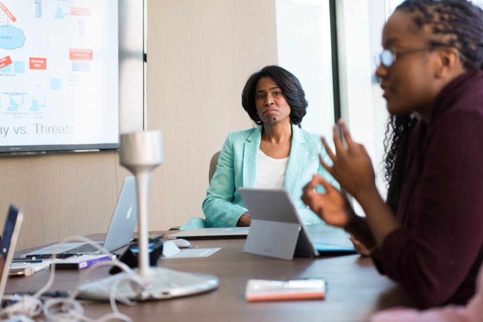 Free Image of Businesswomen working together in meeting room 