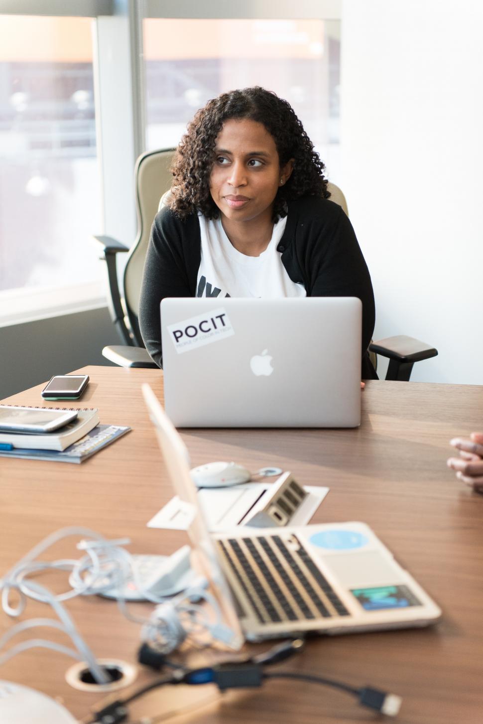 Free Image of Businesswoman with laptops on table in meeting room 