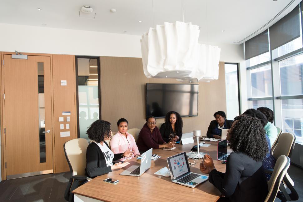 Free Image of Businesswomen discussing a plan with laptop in meeting room 