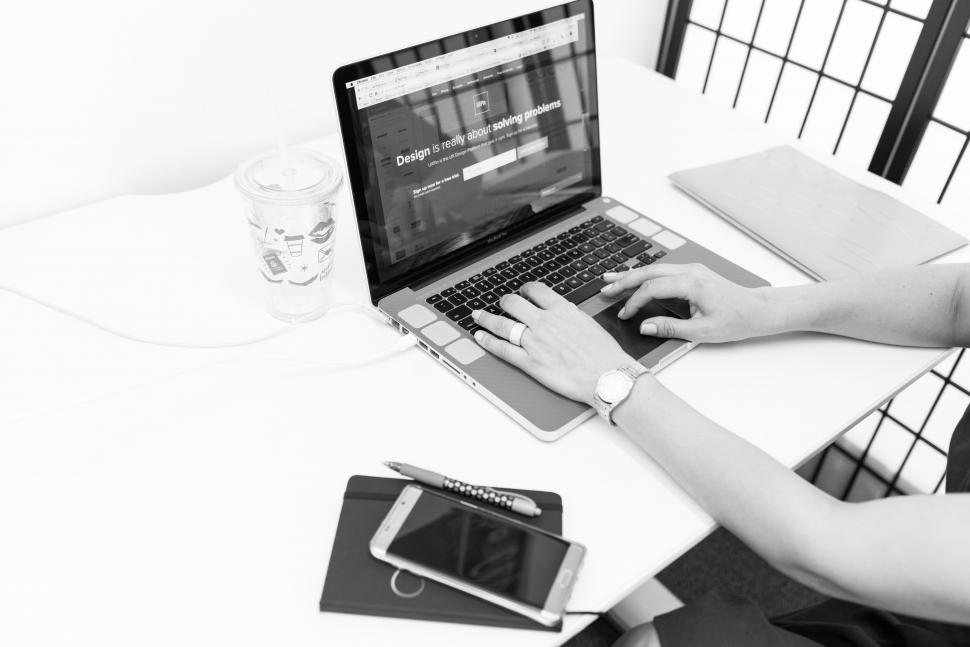 Free Image of Female hands and laptop with smartphone - b&w 