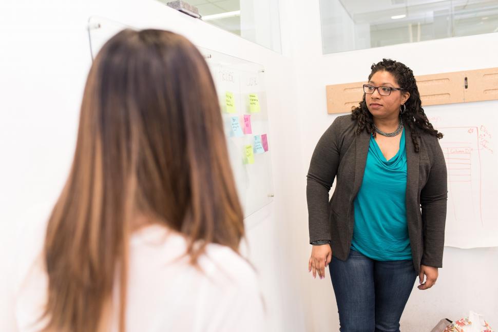 Free Image of Two business women with whiteboard 