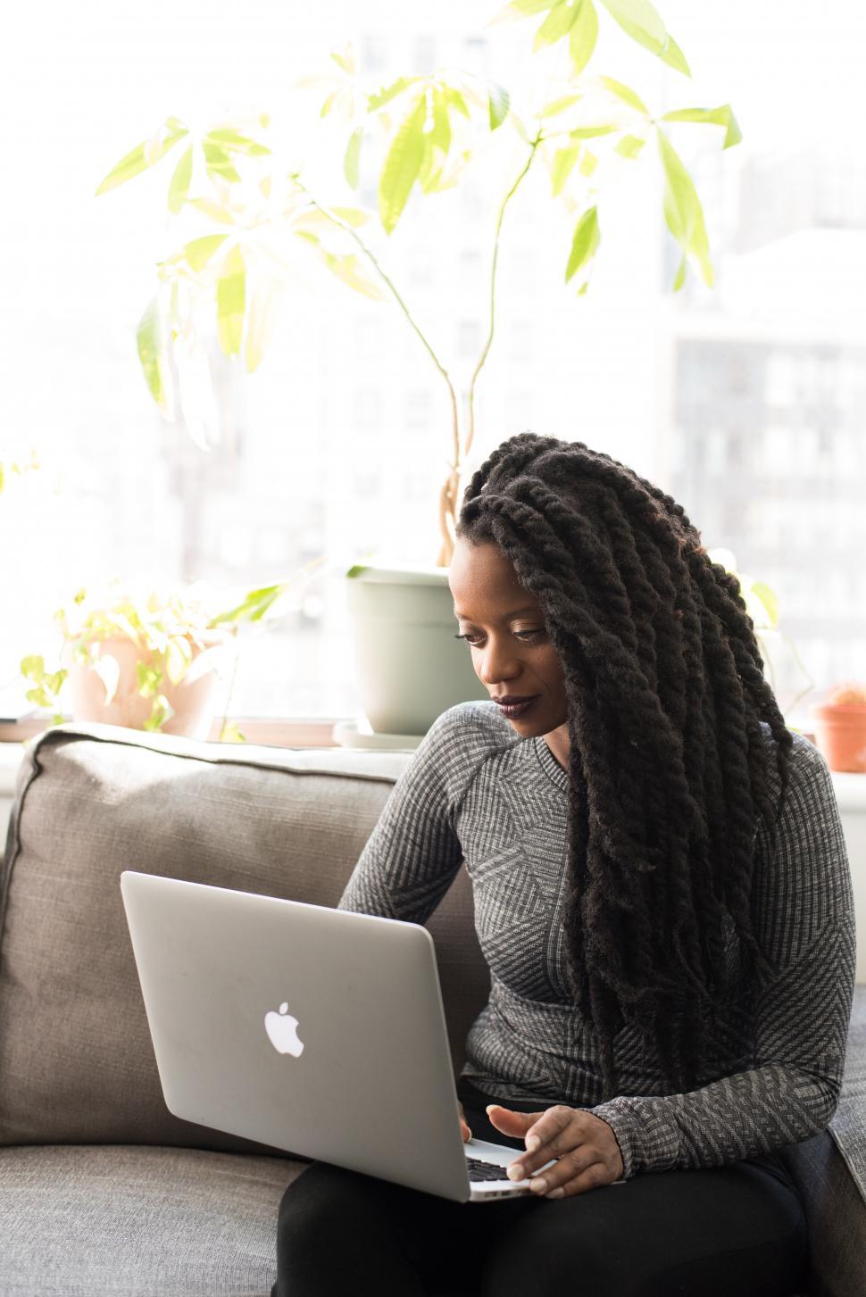 Free Image of Woman with laptop - looking down 