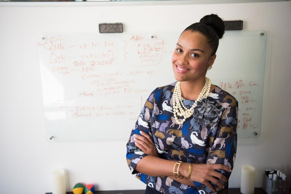 Free Image of Smiling female professional in office - looking at camera 