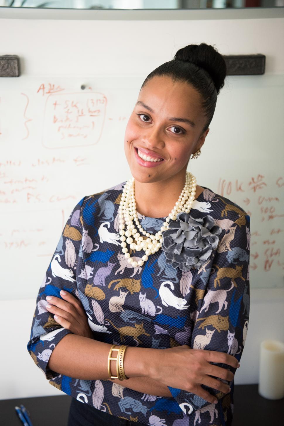Free Image of Smiling female professional with whiteboard in office 