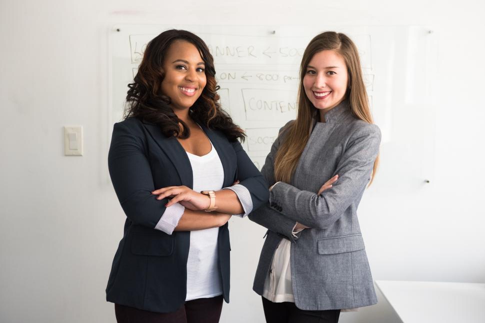 Free Image of Two businesswoman posing for camera - office portrait 