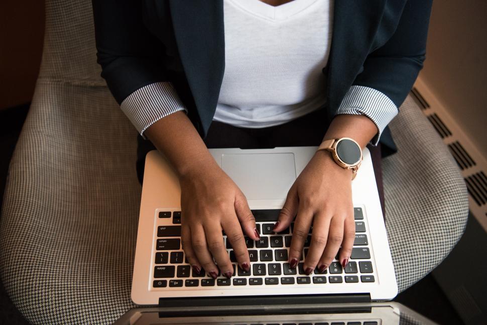 Free Image of Businesswoman hands on laptop keyboard 