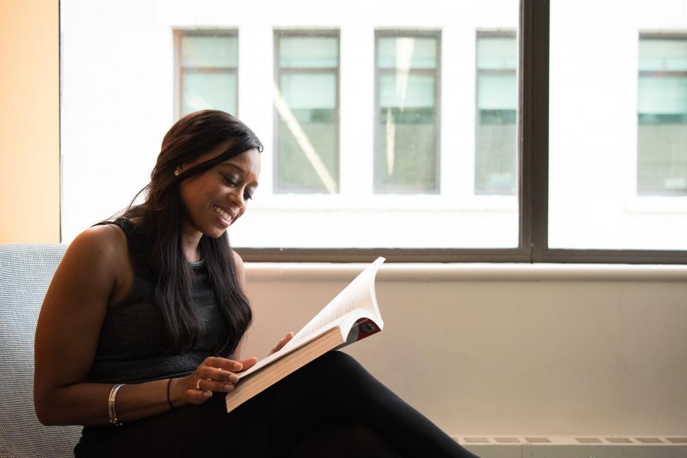 Free Image of Happy woman with book 