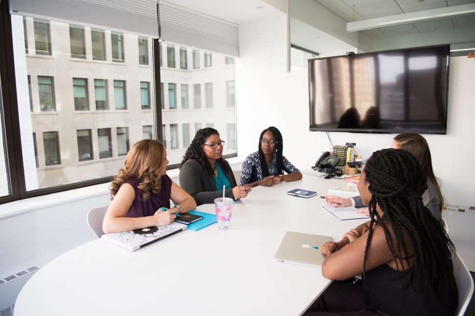 Free Image of Businesswomen discussing a plan with laptop in meeting room 