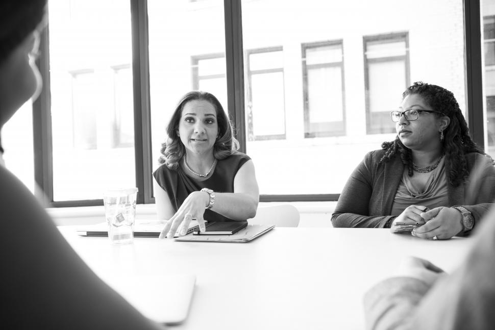 Free Image of Businesswomen discussing a plan with laptop in meeting room 