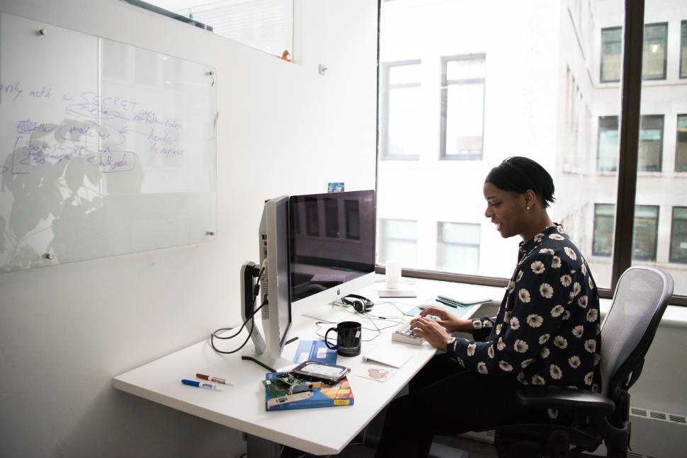 Free Image of Woman typing on computer keyboard in office 
