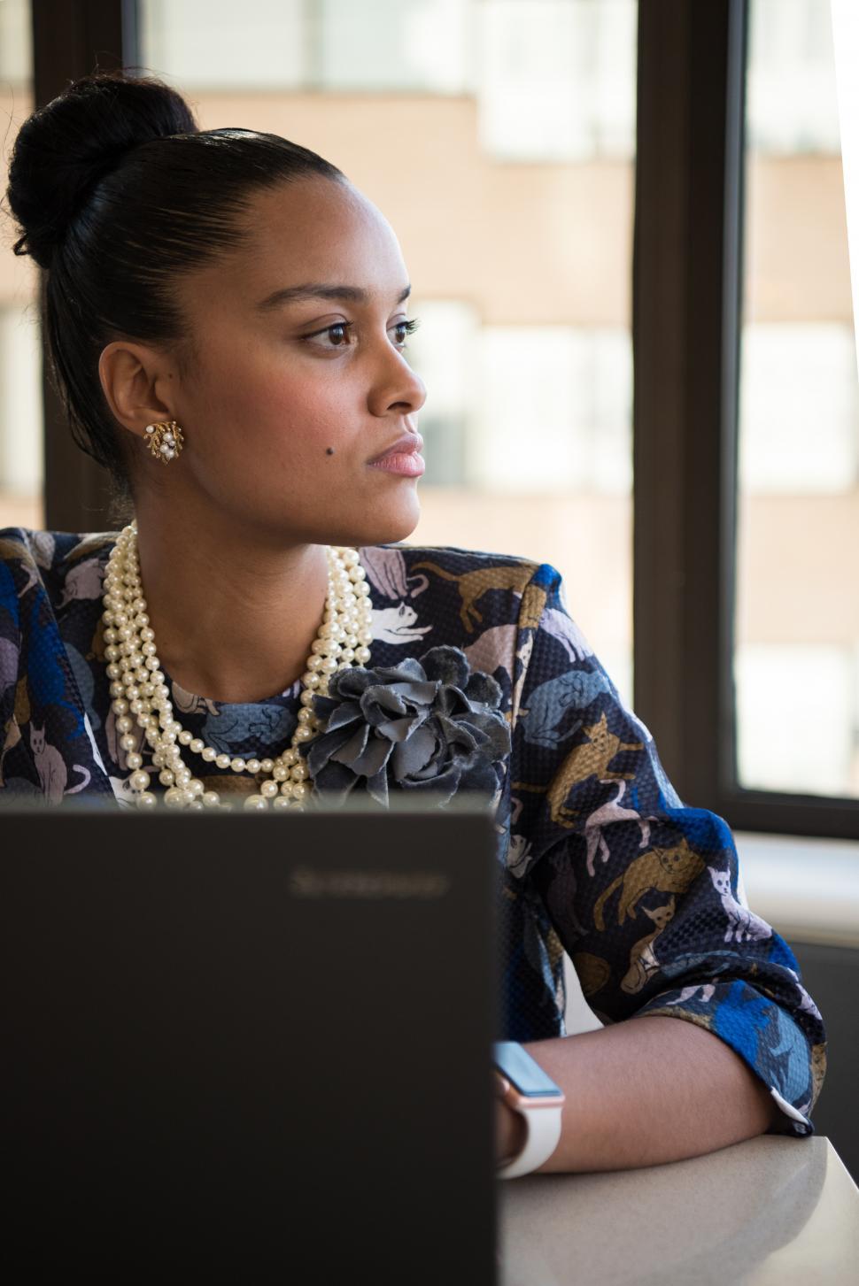 Free Image of Businesswoman with laptop in office - looking away 