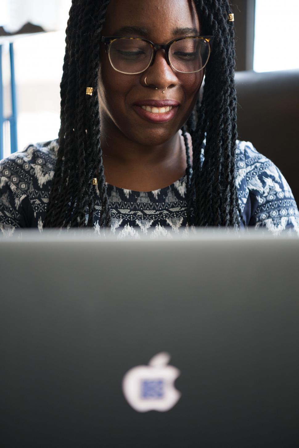 Free Image of Happy female programmer with laptop 
