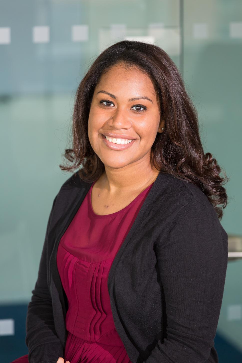 Free Image of Happy female professional in office - eye contact 