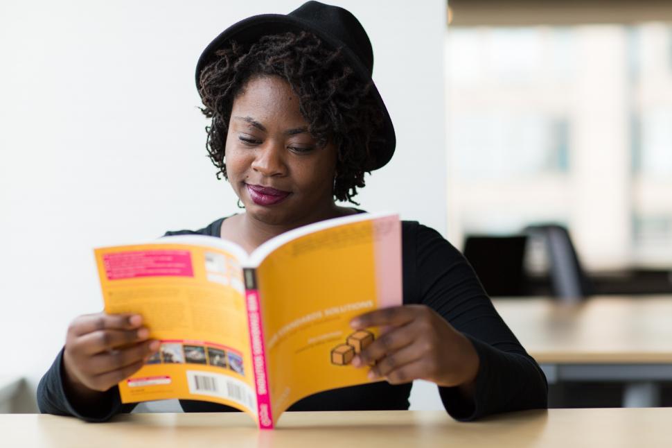 Free Image of Female software developer with book 