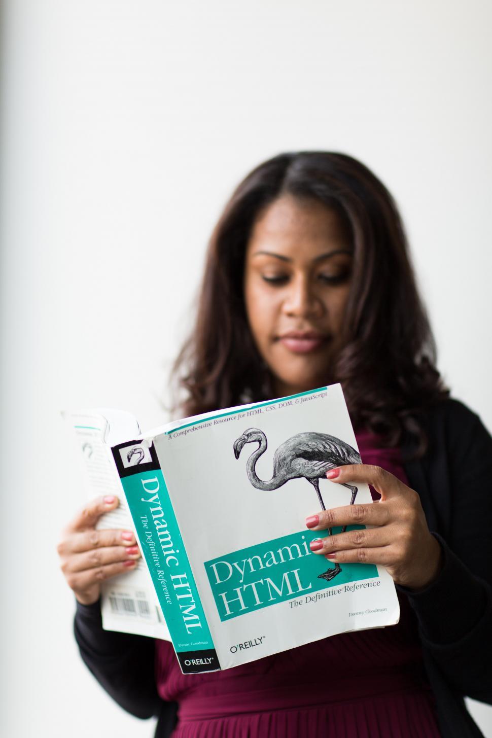 Free Image of Female software developer with book 