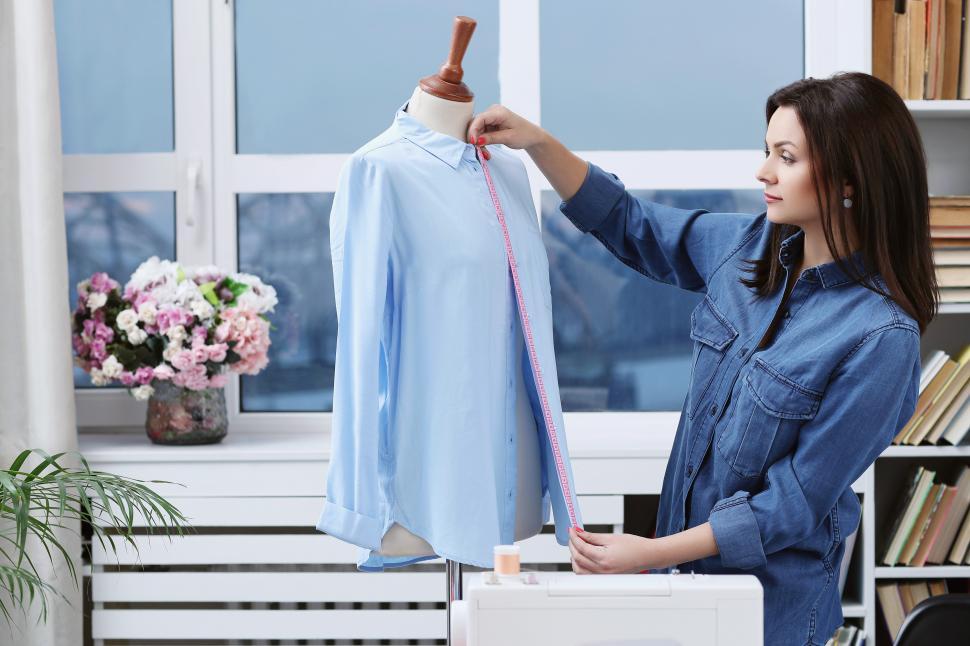 Free Image of Seamstress making alterations 