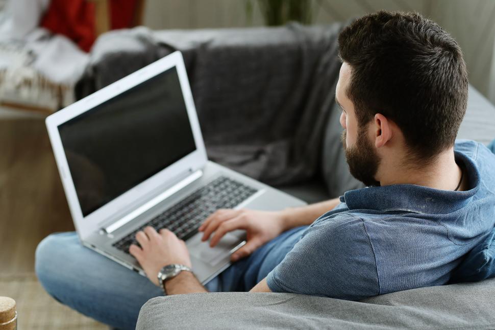 Free Image of Seated man using laptop 
