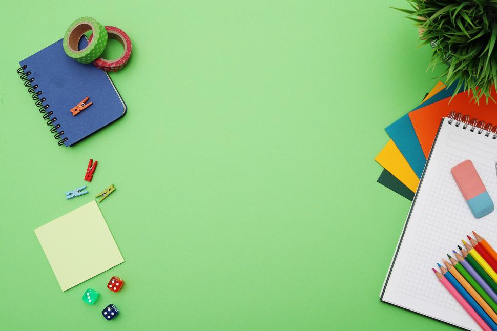 Free Image of Stationery on green background 
